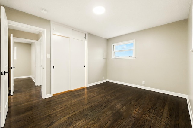 4506 W 77th Pl, Chicago, IL 60652 - unfurnished bedroom featuring dark wood finished floors and a closet