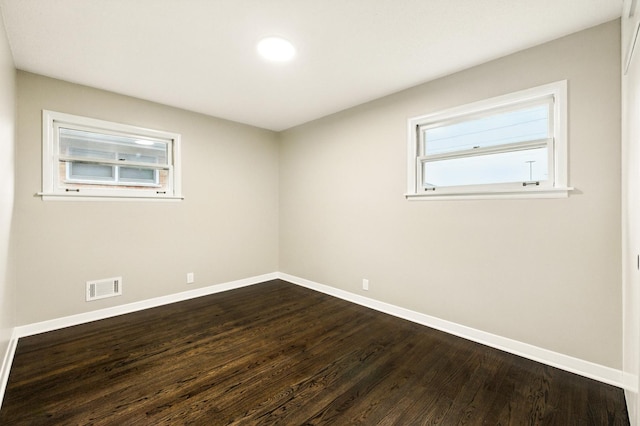 4506 W 77th Pl, Chicago, IL 60652 - empty room featuring baseboards and dark wood-style floors