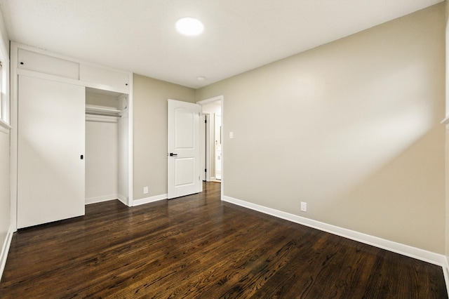 4506 W 77th Pl, Chicago, IL 60652 - unfurnished bedroom featuring dark wood-style floors and a closet