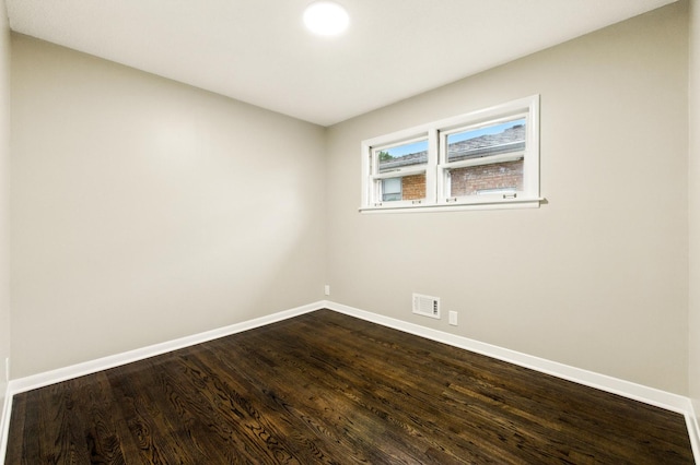 4506 W 77th Pl, Chicago, IL 60652 - unfurnished room featuring baseboards and dark wood-style floors