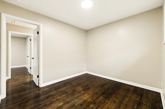 4506 W 77th Pl, Chicago, IL 60652 - empty room with dark wood finished floors and baseboards