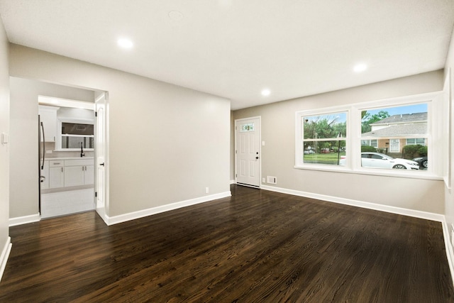 4506 W 77th Pl, Chicago, IL 60652 - unfurnished living room with dark wood-style floors and recessed lighting