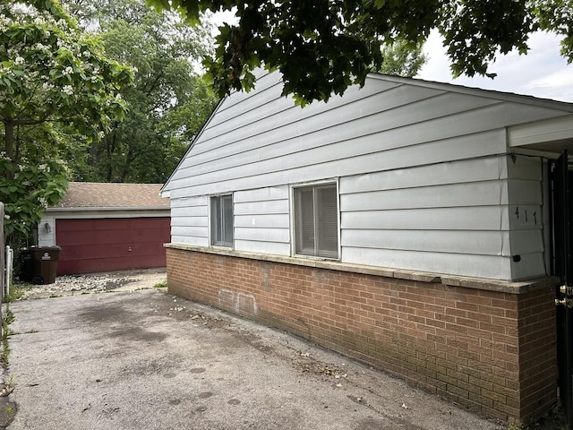 417 Shabbona Dr, Park Forest, IL 60466 - view of side of home with brick siding and an outbuilding