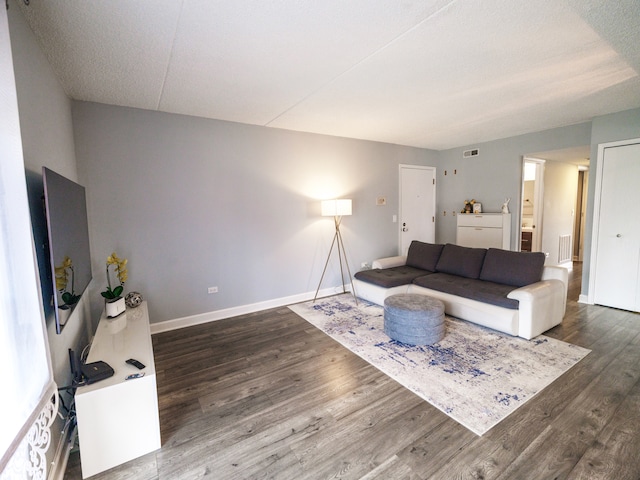 1215 Chalet Rd Unit 200, Naperville, IL 60563 - living area featuring wood finished floors and a textured ceiling