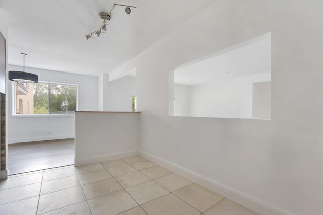 5251 W Galitz St Unit 311, Skokie, IL 60077 - unfurnished room featuring light tile patterned floors and track lighting