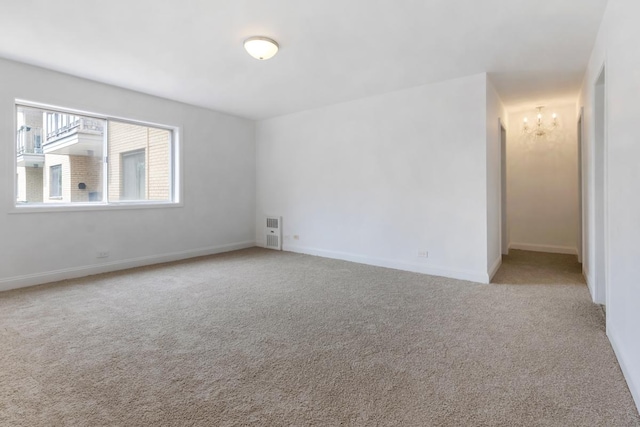 5251 W Galitz St Unit 311, Skokie, IL 60077 - carpeted spare room with baseboards and a chandelier
