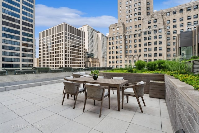 435 N Michigan Ave Unit 1203, Chicago, IL 60611 - view of patio with outdoor dining space and a city view