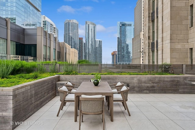 435 N Michigan Ave Unit 1203, Chicago, IL 60611 - view of patio / terrace with a skyline view and outdoor dining space