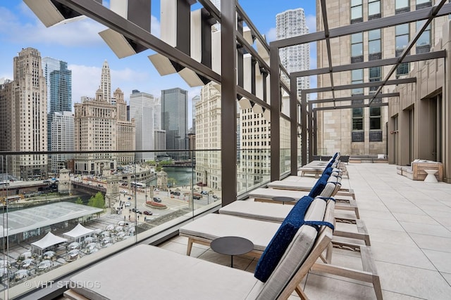 435 N Michigan Ave Unit 1203, Chicago, IL 60611 - view of patio / terrace with a view of skyline, a water view, and a pergola