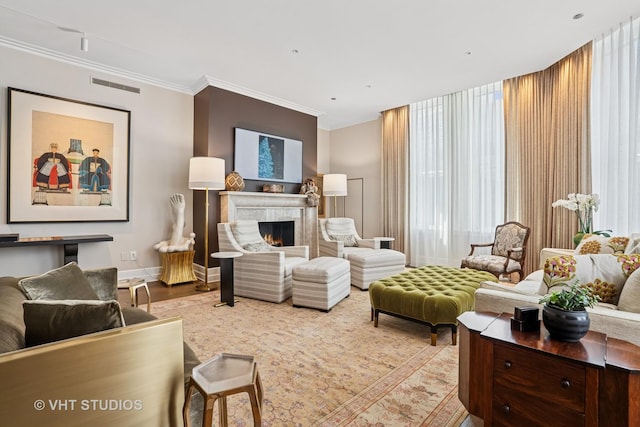 435 N Michigan Ave Unit 1203, Chicago, IL 60611 - living area featuring wood finished floors, a lit fireplace, and ornamental molding