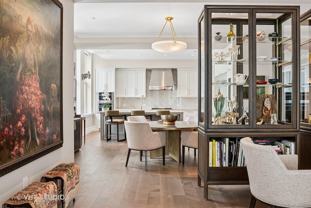 435 N Michigan Ave Unit 1203, Chicago, IL 60611 - dining space featuring hardwood / wood-style floors and ornamental molding