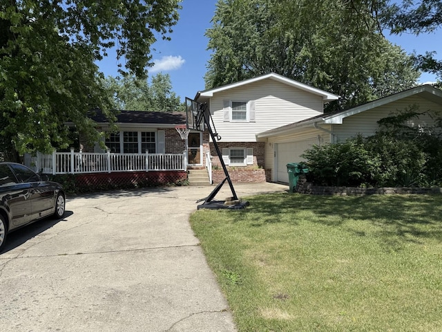 1920 Heather Ln, Joliet, IL 60431 - tri-level home with brick siding, a front yard, an attached garage, and concrete driveway