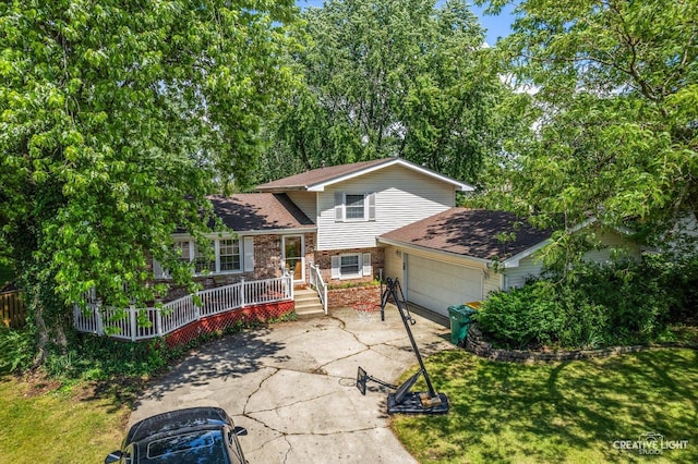 1920 Heather Ln, Joliet, IL 60431 - view of front facade with driveway, a garage, a deck, a shingled roof, and a front lawn