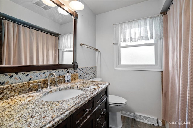1920 Heather Ln, Joliet, IL 60431 - full bath featuring vanity, tasteful backsplash, wood finished floors, and a shower with shower curtain