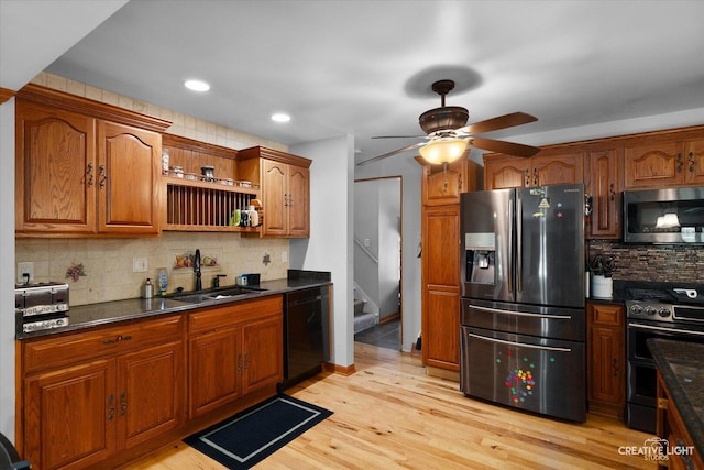 1920 Heather Ln, Joliet, IL 60431 - kitchen featuring appliances with stainless steel finishes, backsplash, a ceiling fan, brown cabinets, and light wood-type flooring