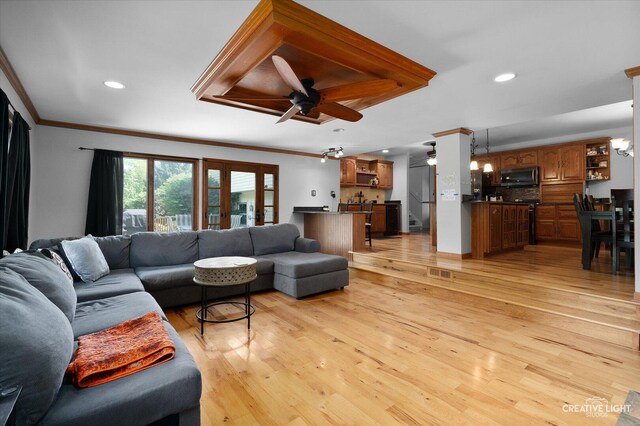 1920 Heather Ln, Joliet, IL 60431 - living area with crown molding, light wood-style flooring, wet bar, a ceiling fan, and recessed lighting