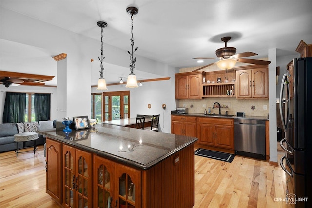 1920 Heather Ln, Joliet, IL 60431 - kitchen with dishwasher, freestanding refrigerator, a ceiling fan, and brown cabinets