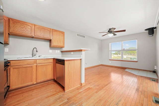 1225 Alexandria Dr, Sycamore, IL 60178 - kitchen with dishwasher, a ceiling fan, light wood-type flooring, light countertops, and a peninsula