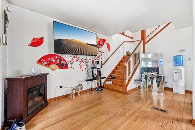 626 E 90th St, Chicago, IL 60619 - entrance foyer featuring hardwood / wood-style flooring, stairway, and a glass covered fireplace