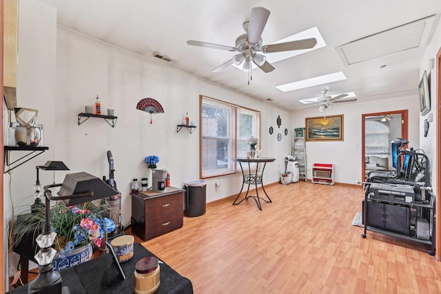 626 E 90th St, Chicago, IL 60619 - playroom with a ceiling fan, light wood-style floors, and a skylight