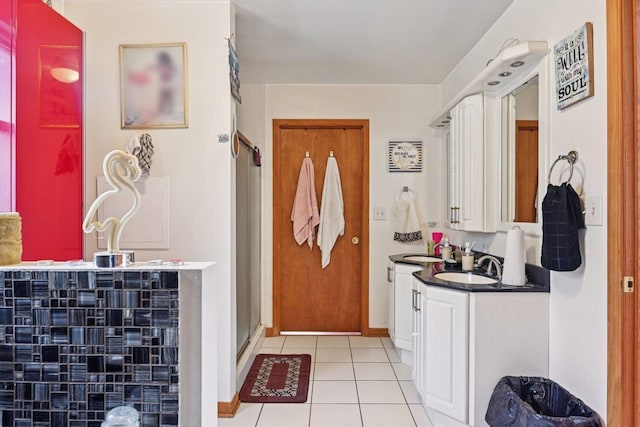 626 E 90th St, Chicago, IL 60619 - bathroom with tile patterned floors, vanity, and a shower stall