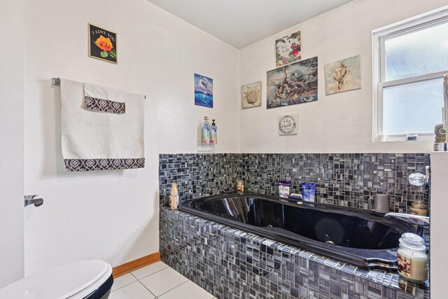 626 E 90th St, Chicago, IL 60619 - bathroom featuring a jetted tub and tile patterned flooring