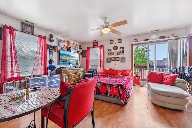 626 E 90th St, Chicago, IL 60619 - bedroom featuring access to exterior, wood finished floors, and ceiling fan