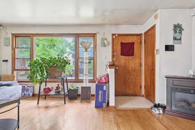 626 E 90th St, Chicago, IL 60619 - foyer entrance featuring hardwood / wood-style floors and a glass covered fireplace