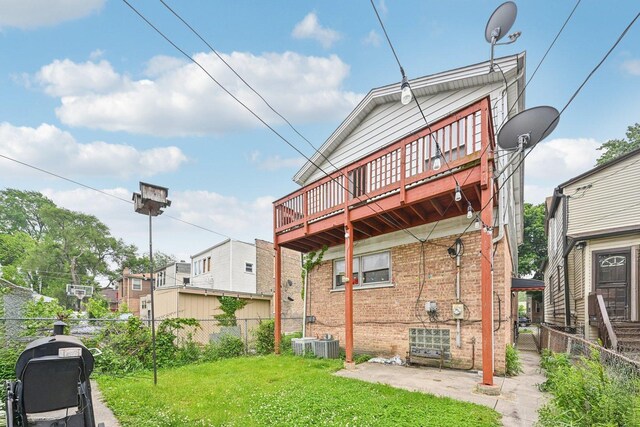 626 E 90th St, Chicago, IL 60619 - back of property with brick siding, a deck, and a patio