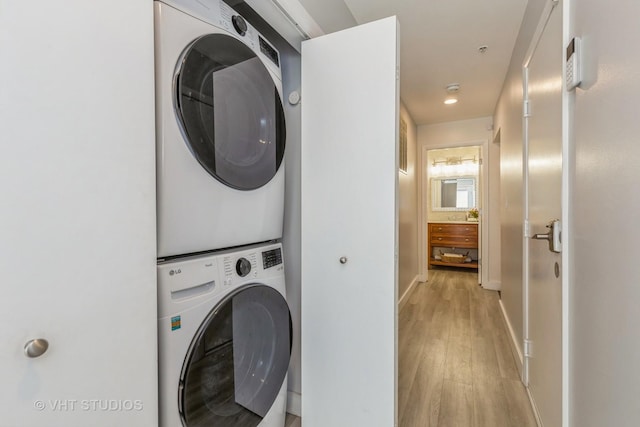 49 W 15th St Unit D, Chicago, IL 60605 - washroom featuring stacked washer and clothes dryer and light wood finished floors