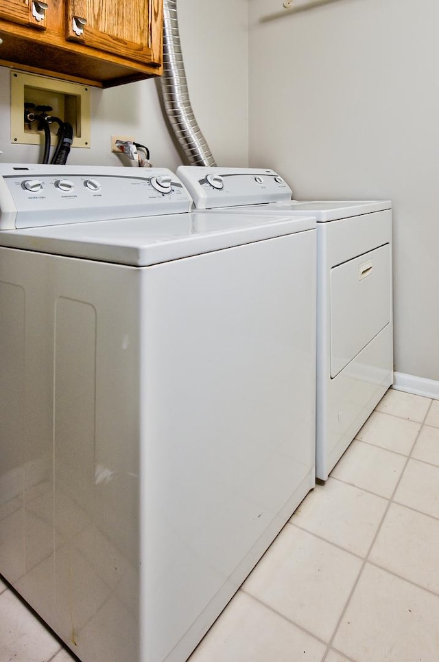2015 N Silver Lake Rd Unit 1, Arlington Heights, IL 60004 - laundry room with cabinet space, washing machine and clothes dryer, and light tile patterned floors