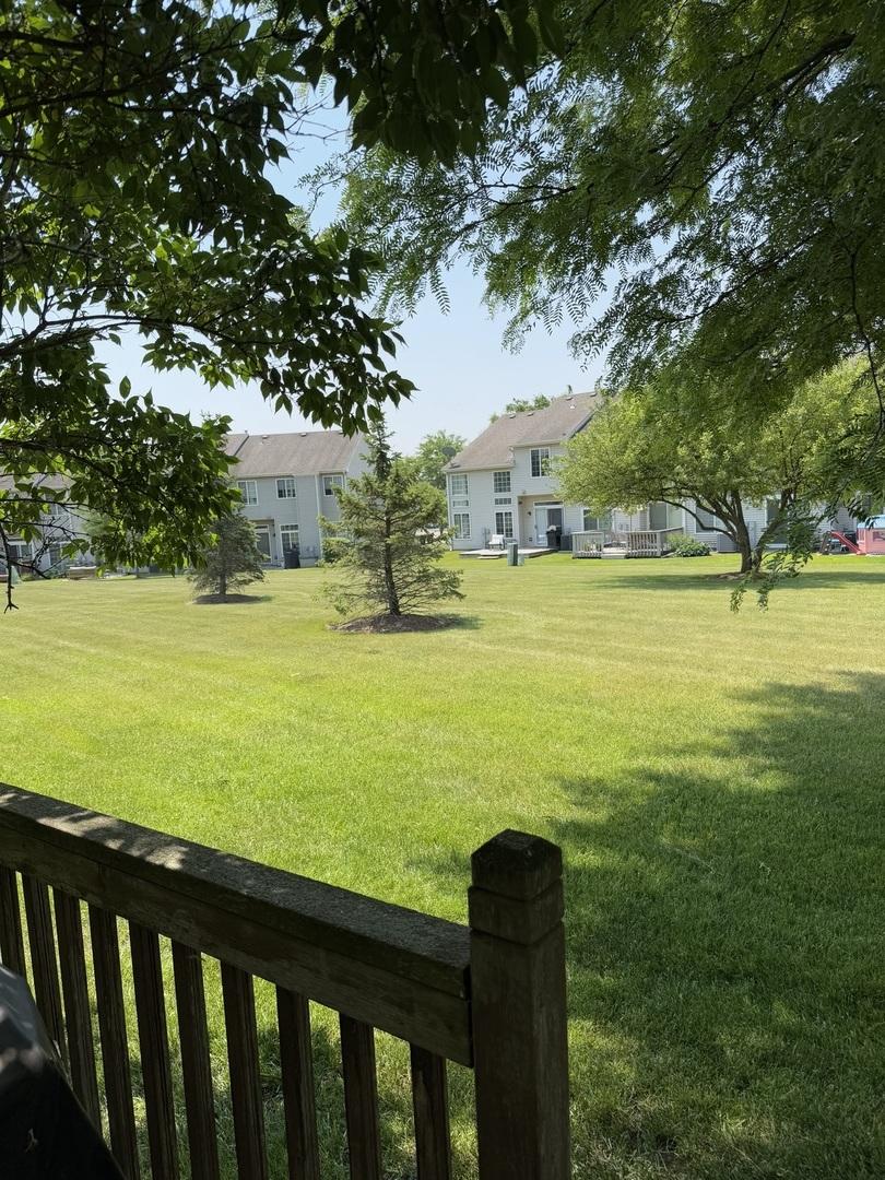 966 Mesa Dr, Lake In The Hills, IL 60156 - view of green lawn featuring a residential view