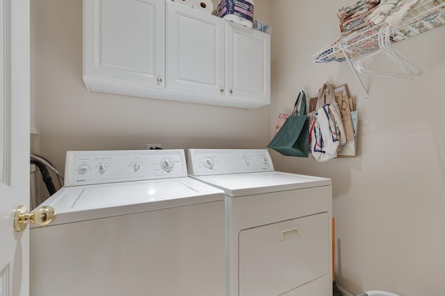 910 Angle Tarn Dr, West Dundee, IL 60118 - laundry area with washer and dryer and cabinet space