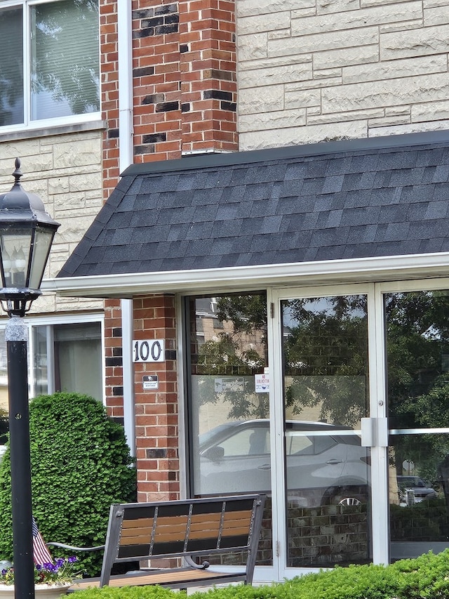 100 W Park Circle Dr Unit 2I, Wheaton, IL 60187 - exterior view of a shingled roof and brick siding