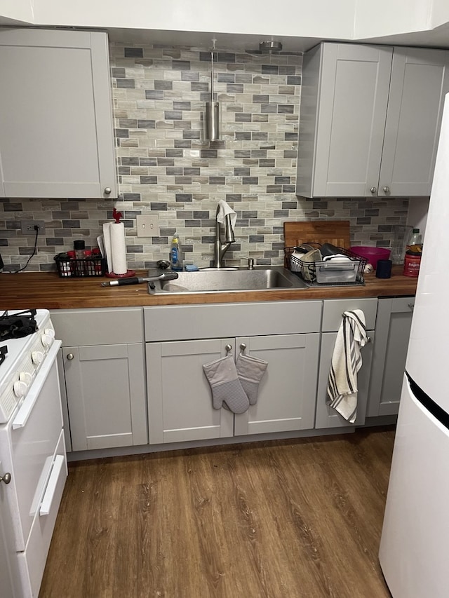 100 W Park Circle Dr Unit 2I, Wheaton, IL 60187 - kitchen featuring white appliances, butcher block counters, decorative backsplash, dark wood-style floors, and white cabinetry