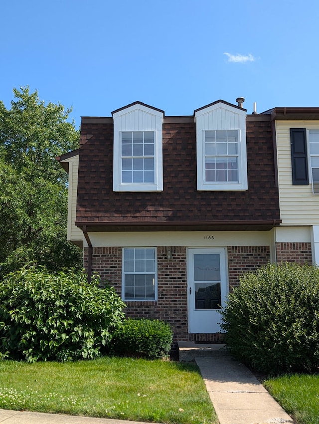 1166 Pomona Dr, Champaign, IL 61822 - view of front of house featuring brick siding and a shingled roof