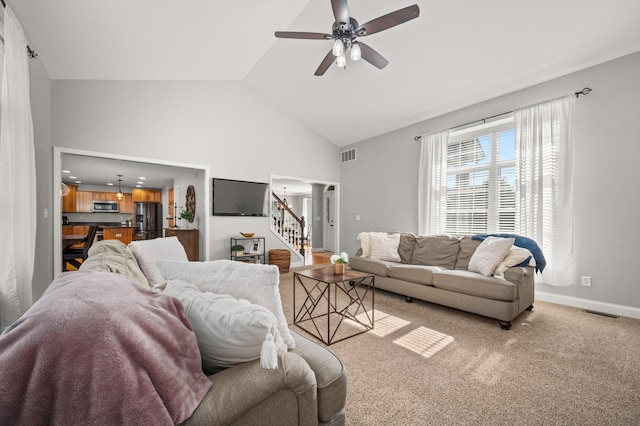 1826 Joseph Sixbury St, Sycamore, IL 60178 - living area featuring stairway, a ceiling fan, high vaulted ceiling, and light carpet