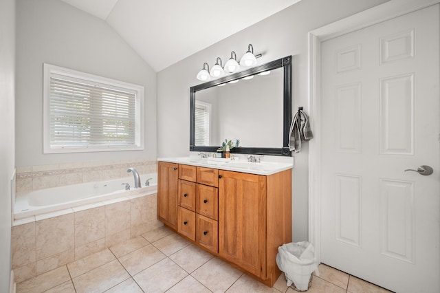 1826 Joseph Sixbury St, Sycamore, IL 60178 - bathroom featuring tile patterned flooring, double vanity, a garden tub, and vaulted ceiling