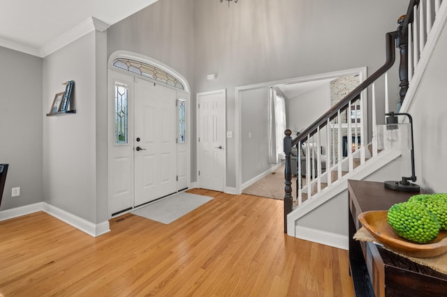 1826 Joseph Sixbury St, Sycamore, IL 60178 - entryway with wood finished floors, stairway, and ornamental molding