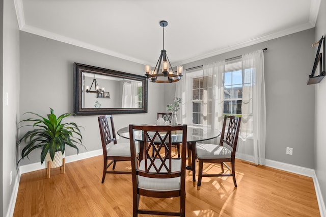 1826 Joseph Sixbury St, Sycamore, IL 60178 - dining room with a chandelier, crown molding, and light wood finished floors
