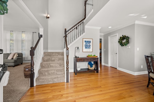 1826 Joseph Sixbury St, Sycamore, IL 60178 - entrance foyer featuring crown molding, light wood-style floors, stairs, and recessed lighting