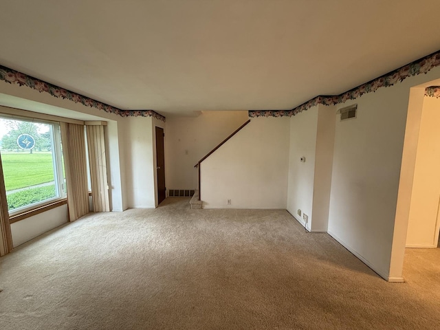 215 Krotiak Rd, Park Forest, IL 60466 - unfurnished living room featuring light colored carpet and stairs