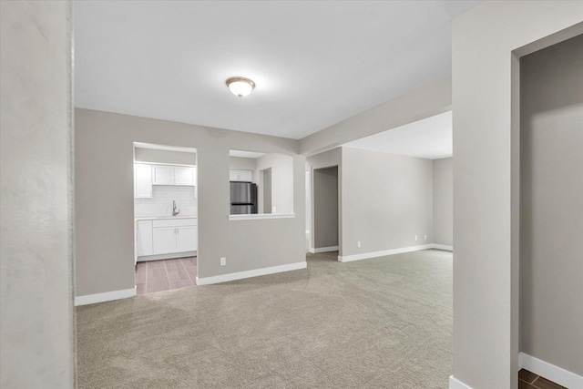 2553 Clayton Blvd Unit 2553, Champaign, IL 61822 - unfurnished living room with a sink and light carpet
