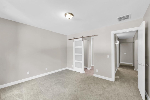 2553 Clayton Blvd Unit 2553, Champaign, IL 61822 - unfurnished bedroom with carpet flooring and a barn door