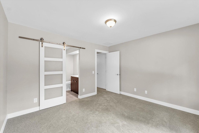 2553 Clayton Blvd Unit 2553, Champaign, IL 61822 - unfurnished bedroom featuring a barn door and carpet
