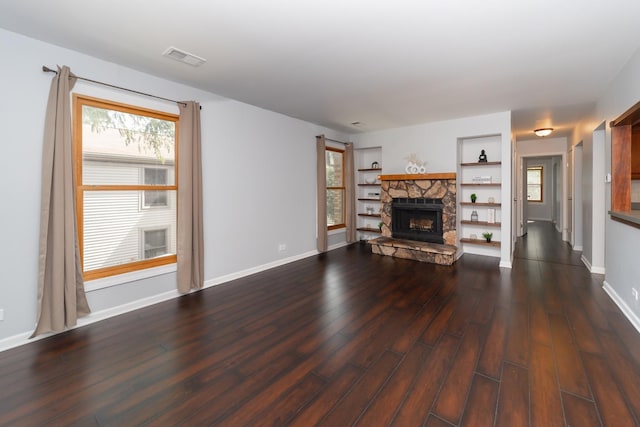 1700 Fayette Walk Unit E, Hoffman Estates, IL 60195 - unfurnished living room with a stone fireplace, dark wood finished floors, and built in shelves