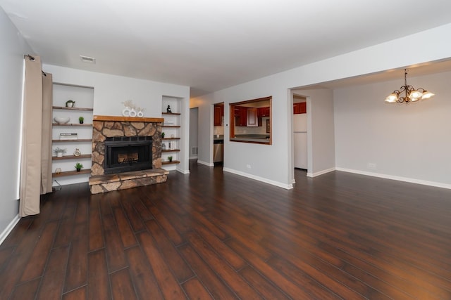1700 Fayette Walk Unit E, Hoffman Estates, IL 60195 - unfurnished living room featuring a fireplace, a chandelier, dark wood-style floors, and built in features