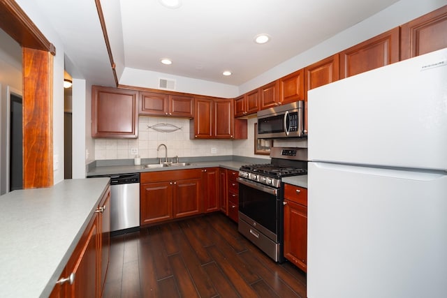 1700 Fayette Walk Unit E, Hoffman Estates, IL 60195 - kitchen with stainless steel appliances, recessed lighting, dark wood finished floors, tasteful backsplash, and light countertops