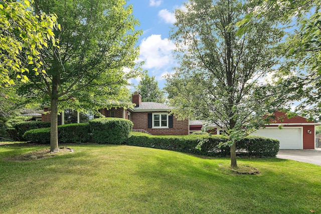 25725 S Old Monee Steger Rd, Monee, IL 60449 - view of front of house with a front yard, driveway, an attached garage, a chimney, and brick siding