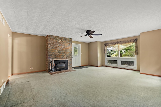 25725 S Old Monee Steger Rd, Monee, IL 60449 - unfurnished living room featuring healthy amount of natural light, carpet floors, ceiling fan, and a stone fireplace